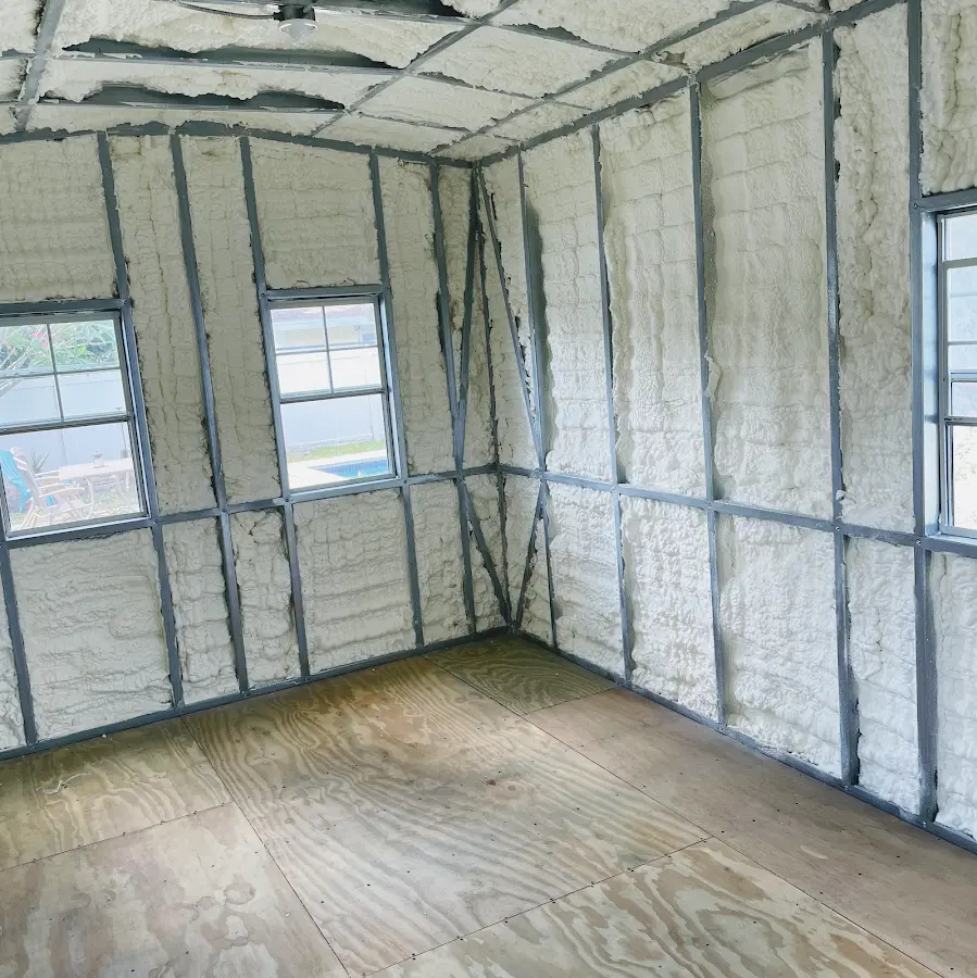 Closed-cell spray foam insulation applied to wall cavities in a residential project in Wellesley
